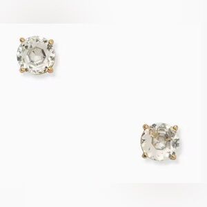Kate spade clear gemstone gum drop earrings with gold accents.